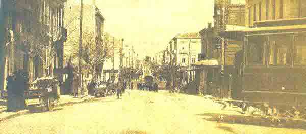 The 3rd Septemvriou street as it once looked when viewed from Omonias Square. Since Athens had tram lines from 1882 until 1960, you can also see a tram in the photograph.