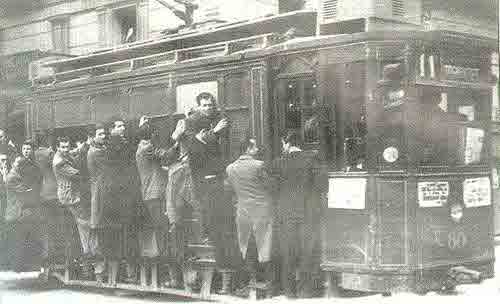 Athens 1944. Passengers hanging from the doors and windows of the tram (Line 11, "Ippokratous-Kolokinthou"). The trams were operated by the company "Athens-Piraeus Tramways".